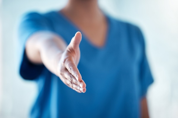 Clinician reaching out to shake hands